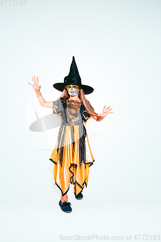 Image of Little girl like a witch on white background