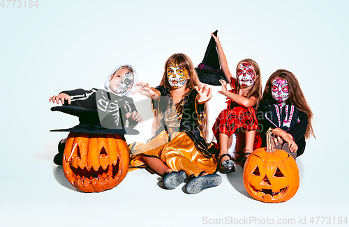 Image of Kids or teens like witches and vampires on white background