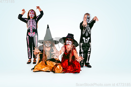 Image of Kids or teens like witches and vampires on white background