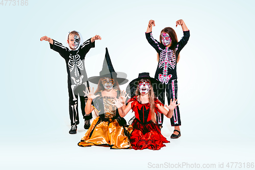 Image of Kids or teens like witches and vampires on white background