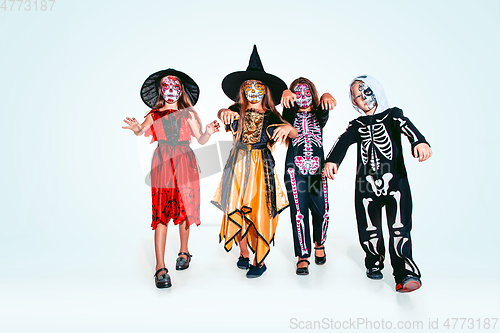 Image of Kids or teens like witches and vampires on white background