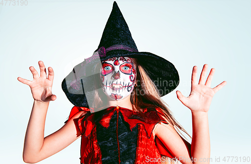 Image of Little girl like a witch on white background