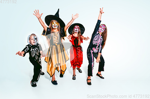 Image of Kids or teens like witches and vampires on white background