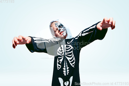 Image of Little boy like a vampire on white background