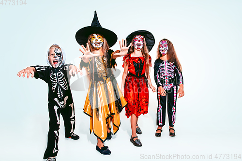 Image of Kids or teens like witches and vampires on white background