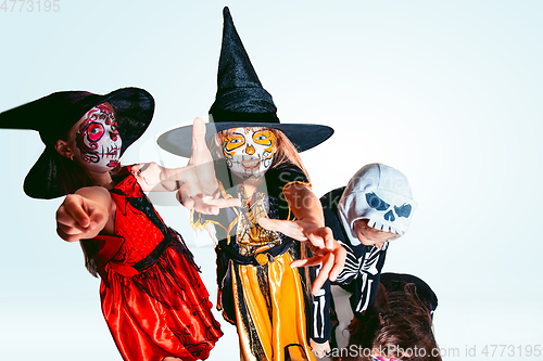 Image of Kids or teens like witches and vampires on white background