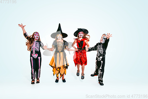 Image of Kids or teens like witches and vampires on white background