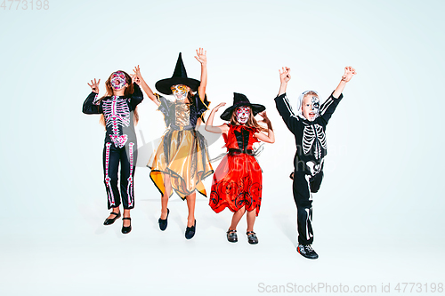 Image of Kids or teens like witches and vampires on white background