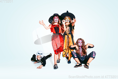Image of Kids or teens like witches and vampires on white background