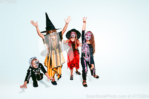 Image of Kids or teens like witches and vampires on white background