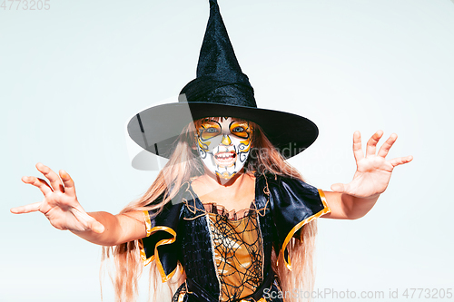 Image of Little girl like a witch on white background