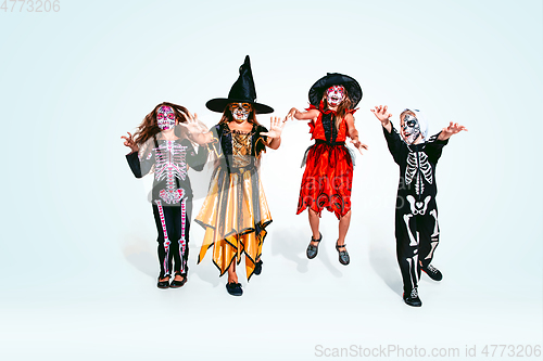 Image of Kids or teens like witches and vampires on white background