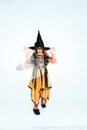 Image of Little girl like a witch on white background