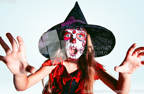 Image of Little girl like a witch on white background