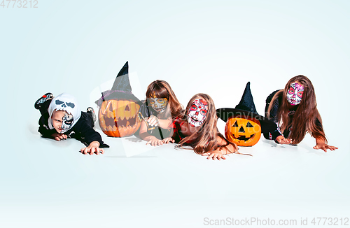 Image of Kids or teens like witches and vampires on white background