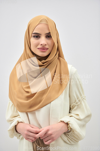 Image of Portrait of young muslim woman wearing hijab on isolated white background