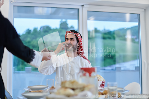 Image of Muslim couple sharing dates for starting iftar