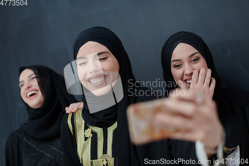 Image of Portrait of Arab women wearing traditional clothes or abaya