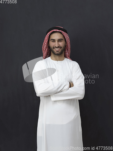 Image of Portrait of young muslim man wearing traditional clothes