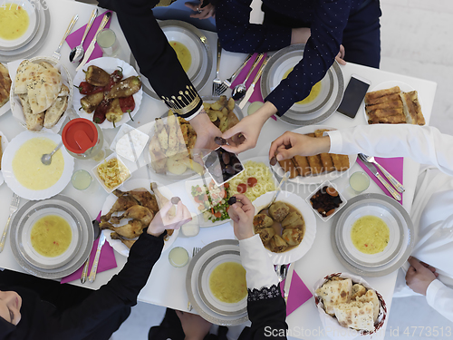 Image of Top view of Muslim family having iftar together during Ramadan