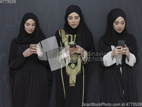 Image of Portrait of Arab women wearing traditional clothes or abaya