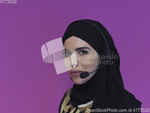 Image of Portrait of young muslim woman with headphones