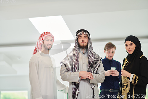 Image of Group portrait of muslim businessmen and businesswoman