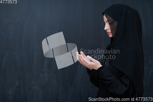 Image of Portrait of young Muslim woman making dua