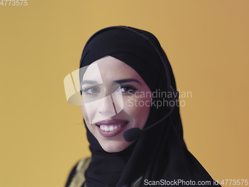 Image of Portrait of young muslim woman with headphones