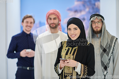 Image of Group portrait of muslim businessmen and businesswoman