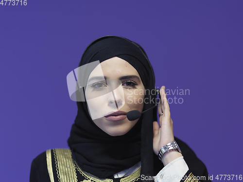 Image of Portrait of young muslim woman with headphones