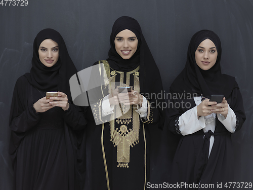 Image of Portrait of Arab women wearing traditional clothes or abaya