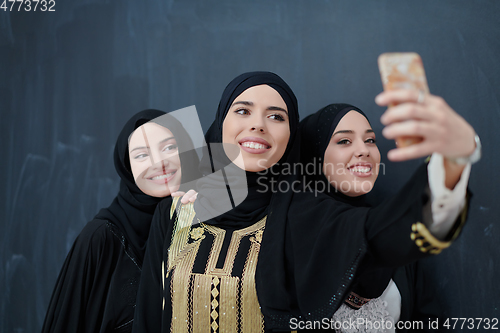 Image of Portrait of Arab women wearing traditional clothes or abaya