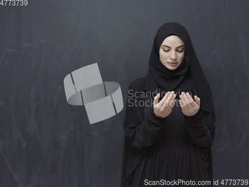 Image of Portrait of young Muslim woman making dua