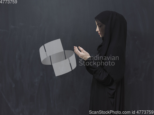 Image of Portrait of young Muslim woman making dua