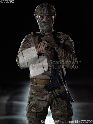 Image of soldier with full combat gear in night mission