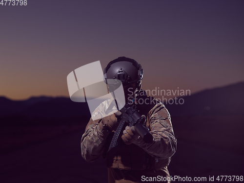 Image of soldier with full combat gear in night mission