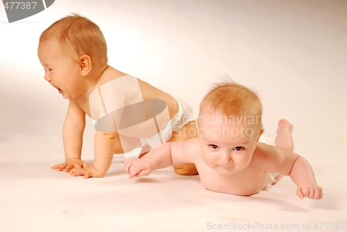 Image of Babies lying on a ground