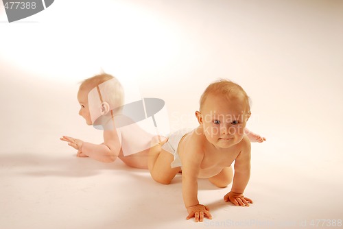 Image of Babies lying on a ground