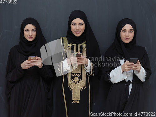 Image of Portrait of Arab women wearing traditional clothes or abaya