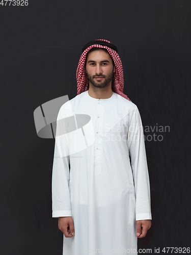 Image of Portrait of young muslim man wearing traditional clothes