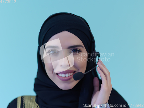 Image of Portrait of young muslim woman with headphones