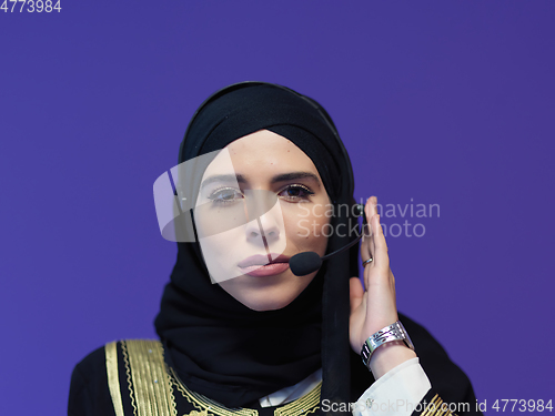 Image of Portrait of young muslim woman with headphones