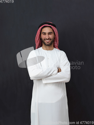 Image of Portrait of young muslim man wearing traditional clothes