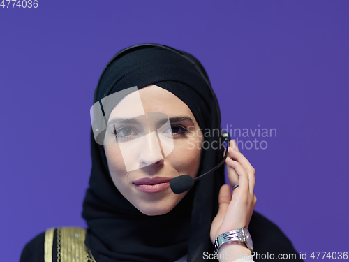 Image of Portrait of young muslim woman with headphones