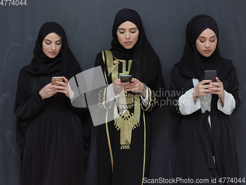 Image of Portrait of Arab women wearing traditional clothes or abaya