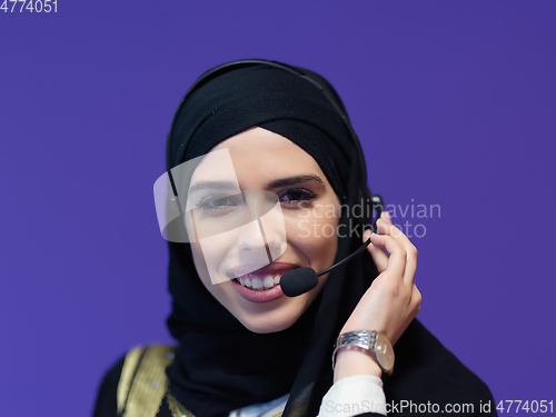 Image of Portrait of young muslim woman with headphones