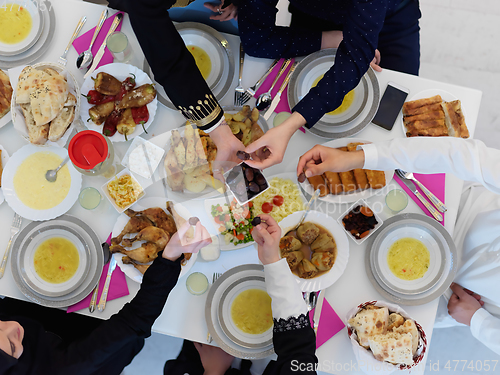 Image of Top view of Muslim family having iftar together during Ramadan