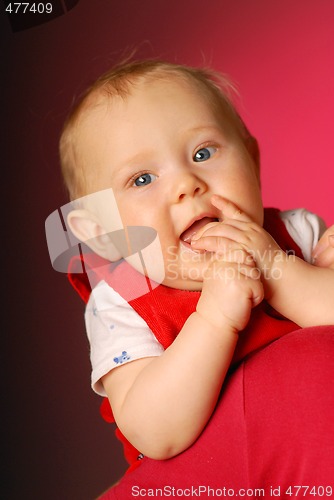 Image of A thoughtful little girl playing with fingers