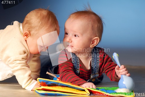 Image of Babies playing with toys